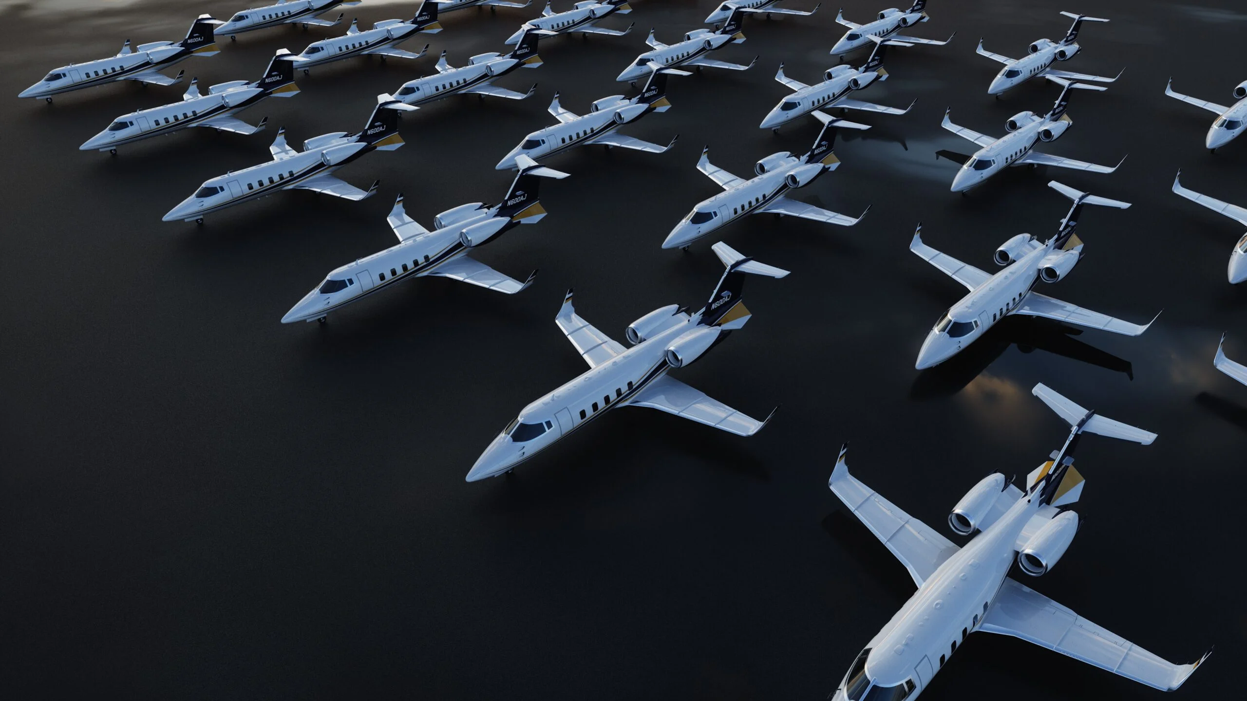 Jet Charter A large group of identical white private jets, available for Private Jet Charter, are lined up in neat rows on a dark, reflective surface, seen from above. Jetvia